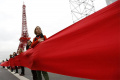 In this 2015 file photo, women take part in a giant red line demonstration from the COP21 Eiffel Tower replica down the Champs Elysee corridor during the World Climate Change Conference 2015 (COP21) in Le Bourget, near Paris, France. In this 2015 file photo, women take part in a giant red line demonstration from the COP21 Eiffel Tower replica down the Champs Elysee corridor during the World Climate Change Conference 2015 (COP21) in Le Bourget, near Paris, France. - Sakshi Post
