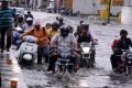 As many of the areas were waterlogged, motorists and commuters faced difficulties after a heavy downpour - Sakshi Post