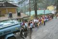 People wait to collect drinking water from the tanker as the city faces acute shortage of drinking water, in Northern hill town Shimla on Sunday. &amp;amp;nbsp; - Sakshi Post
