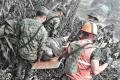 This handout picture released by the Guatemalan National Army shows army personnel as they evacuate a victim of Guatemala’s Volcano Fuego eruption in El Rodeo, Guatemala. This handout picture released by the Guatemalan National Army shows army personnel as they evacuate a victim of Guatemala’s Volcano Fuego eruption in El Rodeo, Guatemala. - Sakshi Post