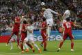 Spains Gerard Pique, center, jumps for a header during the group B match between Iran and Spain at the 2018 soccer World Cup in the Kazan Arena in Kazan, Russia, Wednesday, June 20, 2018. &amp;amp;nbsp; - Sakshi Post