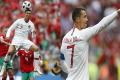 Portugal’s Cristiano Ronaldo leaps up for a header during the group B match between Portugal and Morocco - Sakshi Post