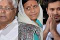 A city court issued summons to former Railway Minister Lalu Prasad, his wife Rabri Devi, son Tejashwi Yadav - Sakshi Post