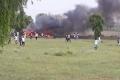 Locals rush to the crash after a MiG 27 jet went down in Jodhpur - Sakshi Post