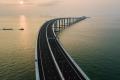 Chinese President Xi Jinping on Tuesday officially opened the world’s longest sea-crossing bridge that connects mainland China with Hong Kong and Macau - Sakshi Post