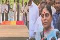 YSRCP honorary president YS Vijayamma paying homage to Dr YSR. (Right) Vijayamma speaking to the media. - Sakshi Post