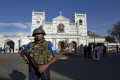 Sri Lankan air force officers and clergy stand outside St. Anthony’s Shrine Sri Lankan air force officers and clergy stand outside St. Anthony’s Shrine - Sakshi Post