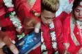 the groom is seen busy playing PUBG at his own wedding. - Sakshi Post