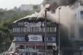 Devastating fire at a coaching centre atop a four-storey building in Sarthana - Sakshi Post