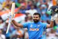 Rohit Sharma raises his bat after scoring a century&amp;amp;nbsp; - Sakshi Post