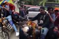 Varma riding pillion along with director Ajay Bhupathi on a Royal Enfield’ driven by another director Agsthya without helmet. Varma riding pillion along with director Ajay Bhupathi on a Royal Enfield’ driven by another director Agsthya without helmet. - Sakshi Post