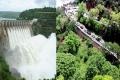 : Thousands of visitors from both the Telugu states, thronged the Srisailam hill shrine and dam on Sunday causing huge traffic jams on the ghat road. - Sakshi Post