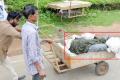Outrage Over Orphan Dead Bodies Shifted To Cemeteries In Garbage Trucks - Sakshi Post