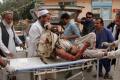 A wounded man is brought by stretcher into a hospital after a mortar was fired by insurgents in Haskamena district of Jalalabad east of Kabul, Afghanistan - Sakshi Post