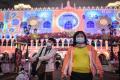 &amp;lt;b&amp;gt; &amp;lt;/b&amp;gt;Visitors wear face masks as they walk outside in Macau, China (Pic courtesy: AFP/ Anthony WALLACE) - Sakshi Post