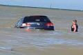 Man battling to save his half-sunk car in Kent, UK Man battling to save his half-sunk car in Kent, UK - Sakshi Post
