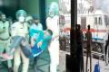 RPF personnel carrying an injured protestor Agnipath Protest: One Killed, Several Injured In Police Firing At Secunderabad Station - Sakshi Post