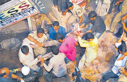 Locals and policemen retrieved the injured from the debris in Chilkalguda, on Monday. - Sakshi Post