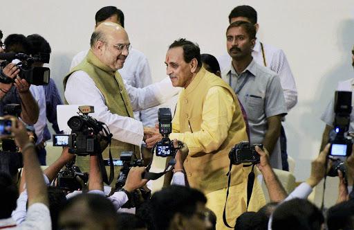 BJP president congratulates Gujarat’s new Chief Minister Vijay Rupani after swearing-in ceremony on Sunday. - Sakshi Post