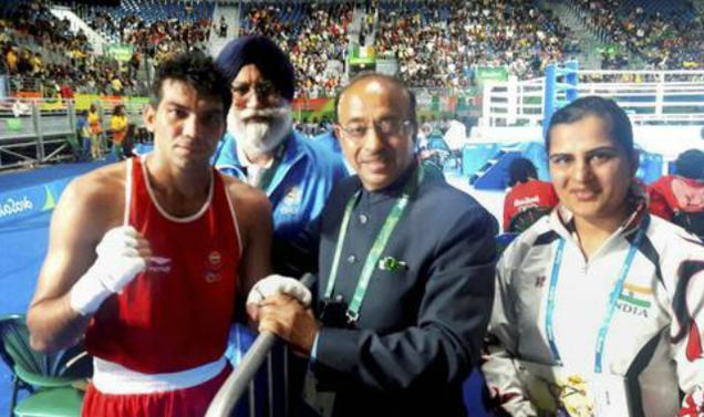 Minister of State for Youth Affairs and Sports (I/C) Vijay Goel greets Indian Boxer Manoj Kumar at Rio de Janeiro on Wednesday. Boxing Coach Shri G.S. Sandhu is also seen. (file photo: PTI) - Sakshi Post
