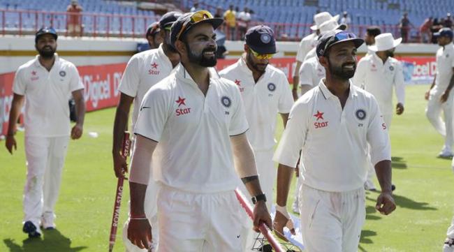 The Indian team members led by Virat Kohli after the victory. - Sakshi Post