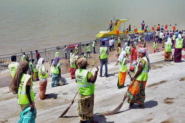 sanitary workers cleaning the Durga Ghat - Sakshi Post