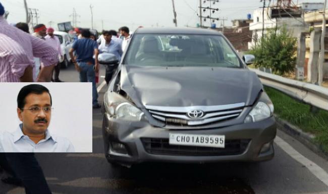 The damaged car and inset chief minister Arvind Kejriwal - Sakshi Post