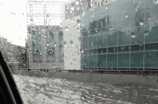 Rain water floods Punjagutta flyover on Friday morning - Sakshi Post