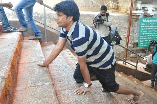 Dhanumjaya Reddy, working as a software engineer at TCS in Bengaluru, started trekking Tirumala Hills on Sunday seeking Special Category Status for AP. - Sakshi Post