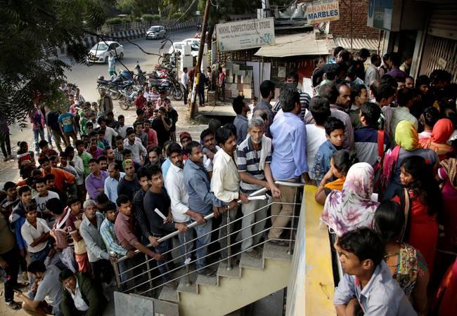 Long queues were seen at banks and ATMs  in both the Telugu states - Sakshi Post