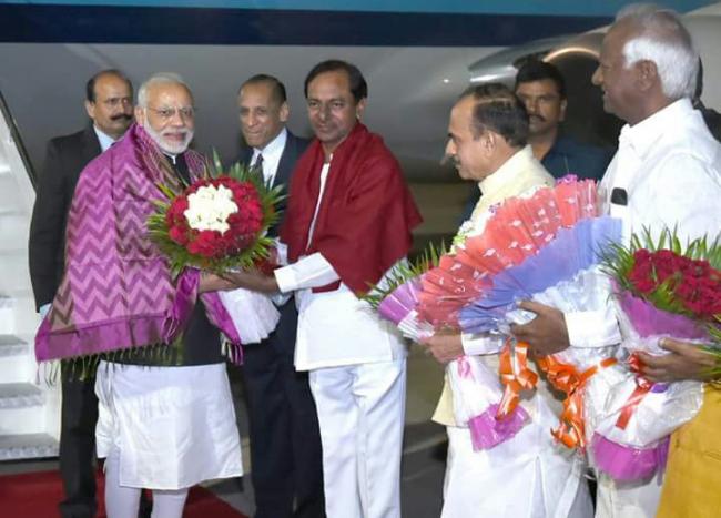 CM KCR with Prime Minister Modi at Shamshabad airport - Sakshi Post