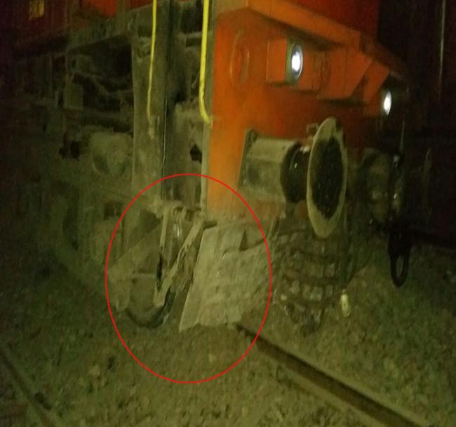 The engine of the ill-fated train standing off the track following the derailment. - Sakshi Post
