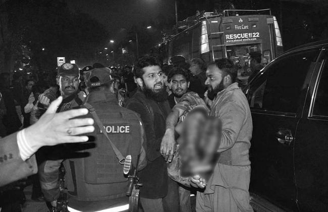 Rescuers shifting the injured from the blast site. Rescuers shifting the injured from the blast site. - Sakshi Post