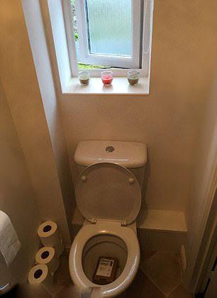 The parcel in the toilet of Sam Cooke, a sports journalist in Wardle, Greater Manchester. - Sakshi Post