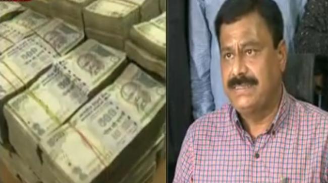 The seized currency notes and (right) Task Force DCP Limba Reddy The seized currency notes and (right) Task Force DCP Limba Reddy - Sakshi Post