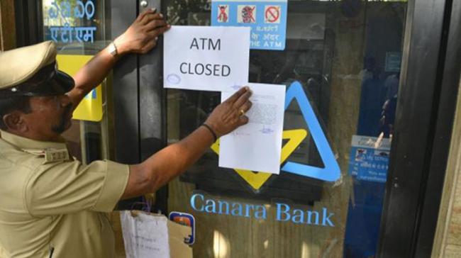 ATM Closed signs popped up at several ATM centers across the country on Monday - Sakshi Post
