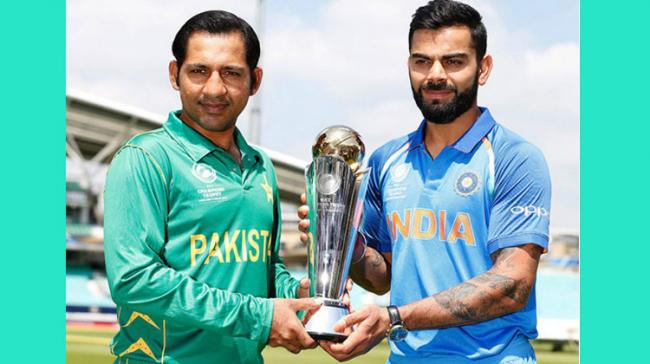 Indian skipper Virat Kohli and his Pakistani counterpart Sarfraz Ahmed posed with the trophy ahead of the final match of the ICC Champions Trophy 2017 due on Sunday. - Sakshi Post