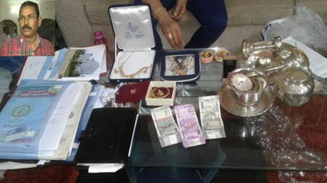 The officials unearthed Rs2 lakh cash, 260 grams gold, half-kg silver from Bapuji’s (inset) house at Santhi Shikara Apartments, Somajiguda - Sakshi Post