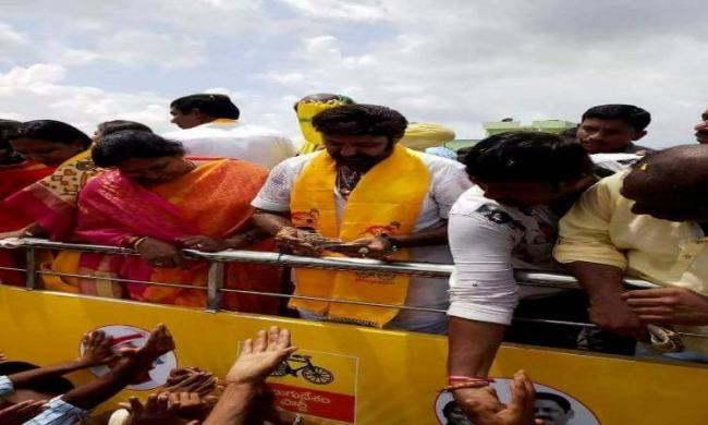Nandamuri Balakrishna giving money to voters during the campaign at Nandyal - Sakshi Post