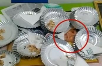 A TV screen grab showing Chandrababu’s photo frame being used as a garbage bin - Sakshi Post