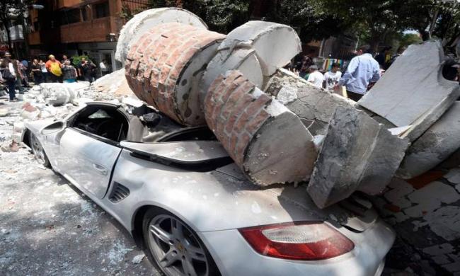 A debris of a building fell on the car after Mexico city was hit by quake&amp;amp;nbsp; - Sakshi Post