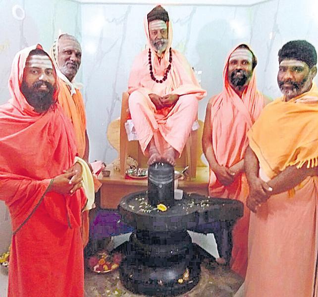 Santalingeswara Swami putting his feet on the Sivalingam - Sakshi Post