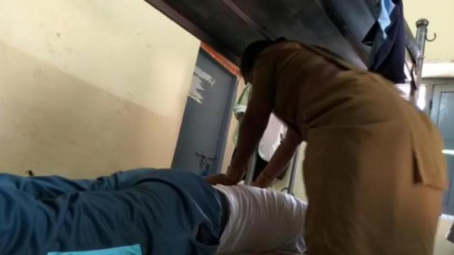 Video grab of woman constable massaging ASI Hussain - Sakshi Post