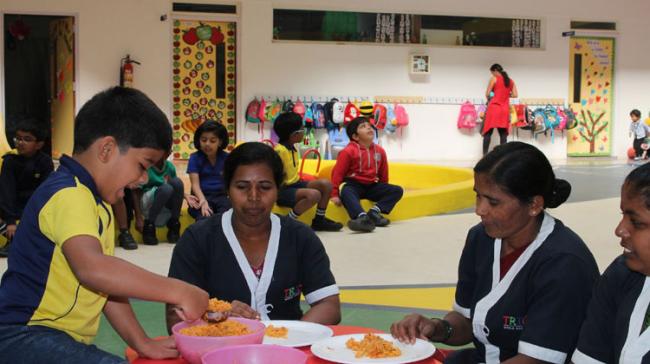 Kids serving breakfast to their nannies to mark Thanksgiving Day, on Thursday. Kids serving breakfast to their nannies to mark Thanksgiving Day, on Thursday. - Sakshi Post