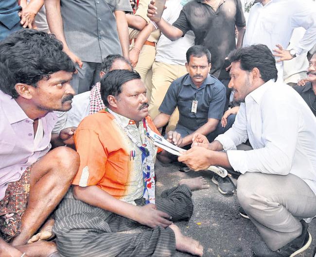 YS Jagan listens the woes of a disabled person at H Kairawadi in Gonegandla mandal - Sakshi Post