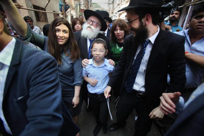 Rabbi Nachman Holtzberg with his grandson ‘little’ Moshe. - Sakshi Post