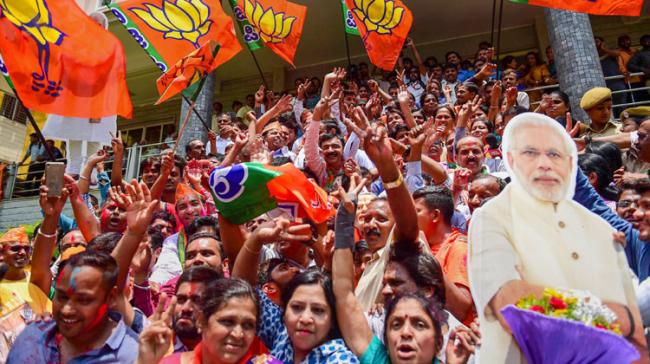 BJP workers celebrating victory in Bengaluru - Sakshi Post
