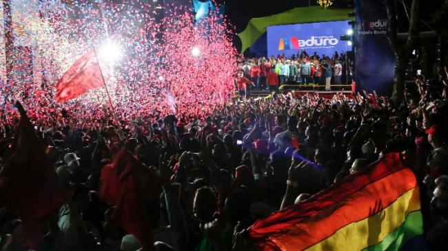 Supporters of Venezuelas President Nicolas Maduro gather at the presidential palace in Caracas - Sakshi Post