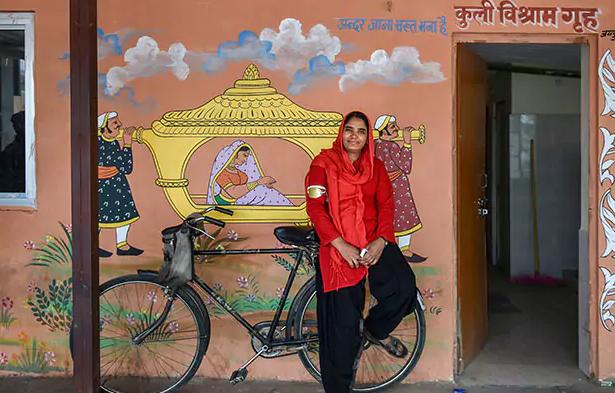 Manju Devi took to the demanding task of hauling luggage at the Jaipur Railway Station Manju Devi took to the demanding task of hauling luggage at the Jaipur Railway Station - Sakshi Post