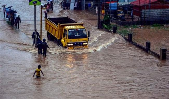 Rescuers at work in a flooded locality after a thunderstorm, in Mangaluru. - Sakshi Post